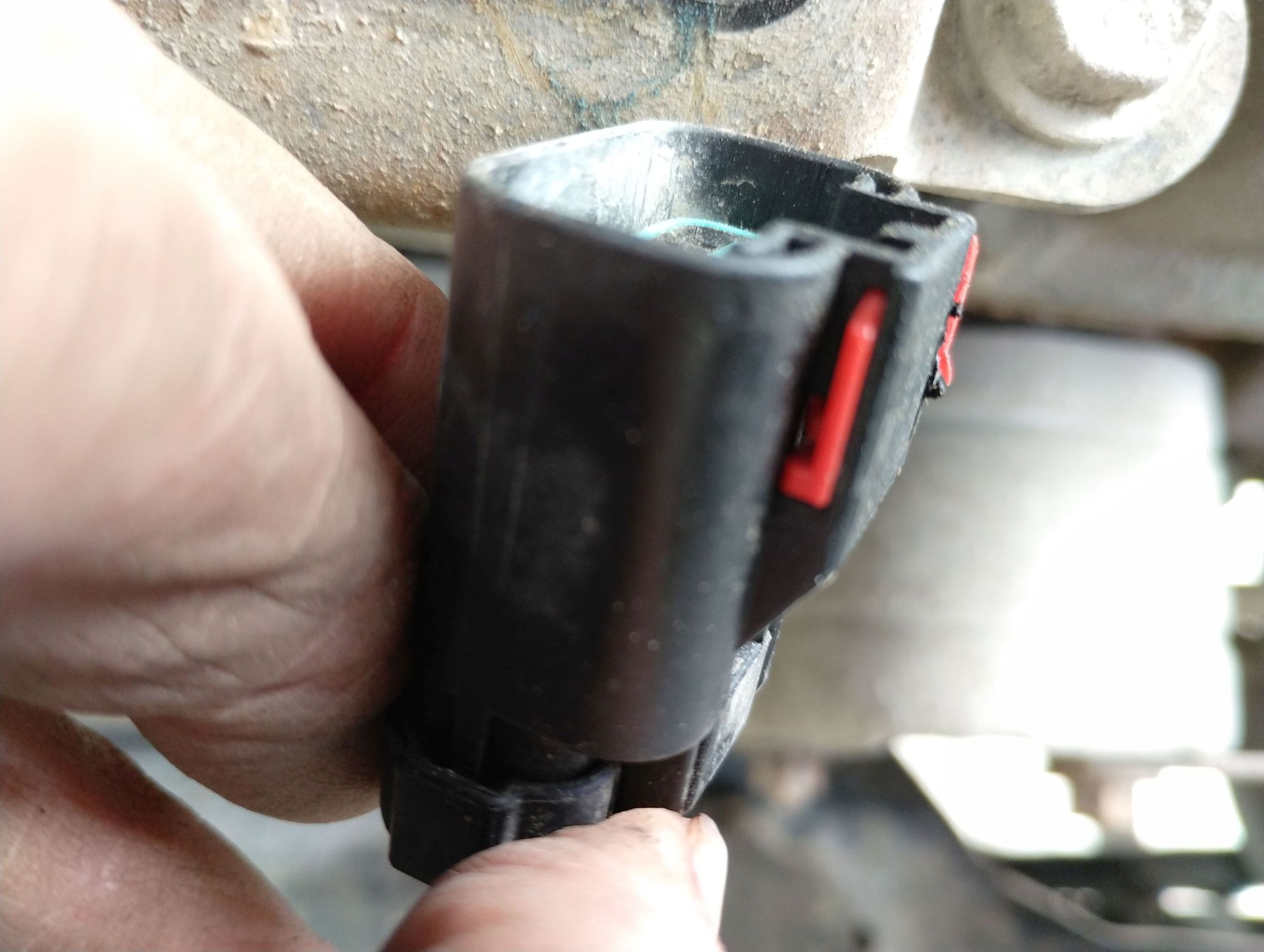 This is what you see when you look at the side of the plug with a dental mirror. So: use a couple drops of Kroil to help ease things along, can you see the tit just above the bottom of the 