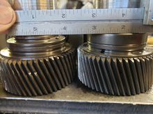 Newer double roller style left, older single roller right. The difference is .3125" or 5/16" because the single is 5/8" wide while the double is 15/16"