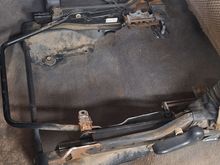 This is what makes the extra cab seats easy: the lower cushion simply unbolts and can be lifted out