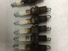 Did some routine maintenance in order to track down a cylinder 6 misfire. Top plug came out of number 6 with a lot of difficulty. Electrode is burned down past the level of the porcelain. Rest of the plugs had lost about .015. Runs much smoother now.