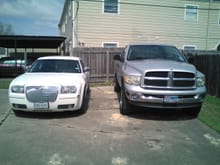 Both of my babies! 03 Ram Laramie 4x4 and my wife's 2010 Chrysler 300 Touring Edition!!