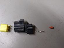 The little orange bushing on the right is rubber