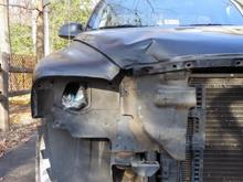 Initial damage after removing the headlight, grill and bumper.