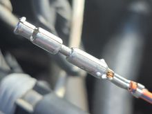 Carefully pinch this split closeder, just on left end. Then try on male pin on TPS.