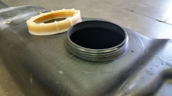 Screw on nut. Much better than the clamp one on the earlier pre 1991 models