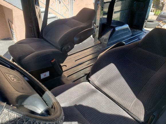 Upgraded the seating by pulling these reclining captains chairs out of another van at the LKQ yard!