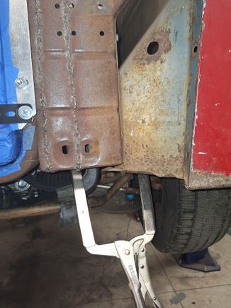 Drivers side core support & fender notched over frame.
