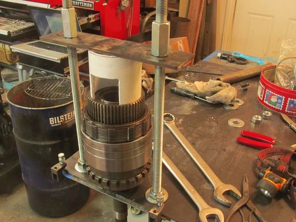 Short length of 1/4 plate seemed strong enough for the head plate. Used a 3in Sched 40 PVC coupler, slotted to allow for access to the snap ring that holds it all together. This is the clutch pack going back in.