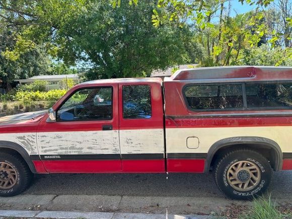 1993 Dodge Dakota. Runs great. Cold AC. I love her and am getting ready to restore outside. Think I will remove topper.