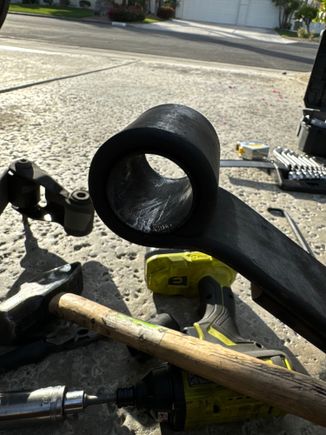 Thin tubular piece of metal inside leaf spring eye. 