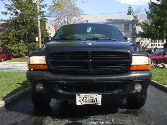 You might be able to see the bent rad support, rad and condensor as well as the scratched bumper with the zip tied license plate.  That was after I put it into a ditch.  Oops....
