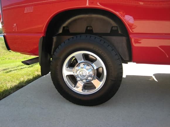 I think this was my first mod for the truck after I bought it...wheel well liners and mopar mud flaps.  These meats throw up all sorts of rocks up the panels/rockers...quick fix and looks clean.