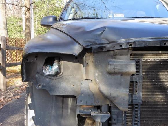Initial damage after removing the headlight, grill and bumper.