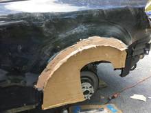 Cardboard "mold" to keep wheel well arch shape. I made this before chopping out the original rust.