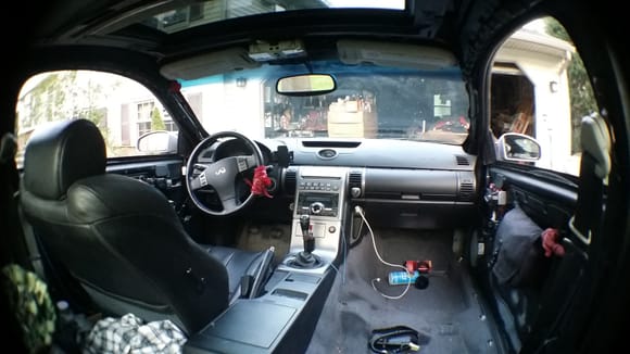 Passenger seat removed (POV from back). Also note the headliner was removed, all metal was painted flat black. I'm not crazy about the tan sunvisors and sunroof slider, so those may require some attention.