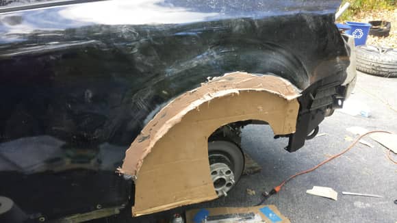 Cardboard "mold" to keep wheel well arch shape. I made this before chopping out the original rust.