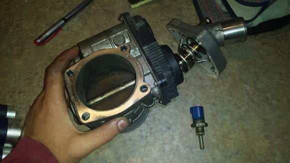 Dirty throttle body, old coolant sensor, and new thermostat.