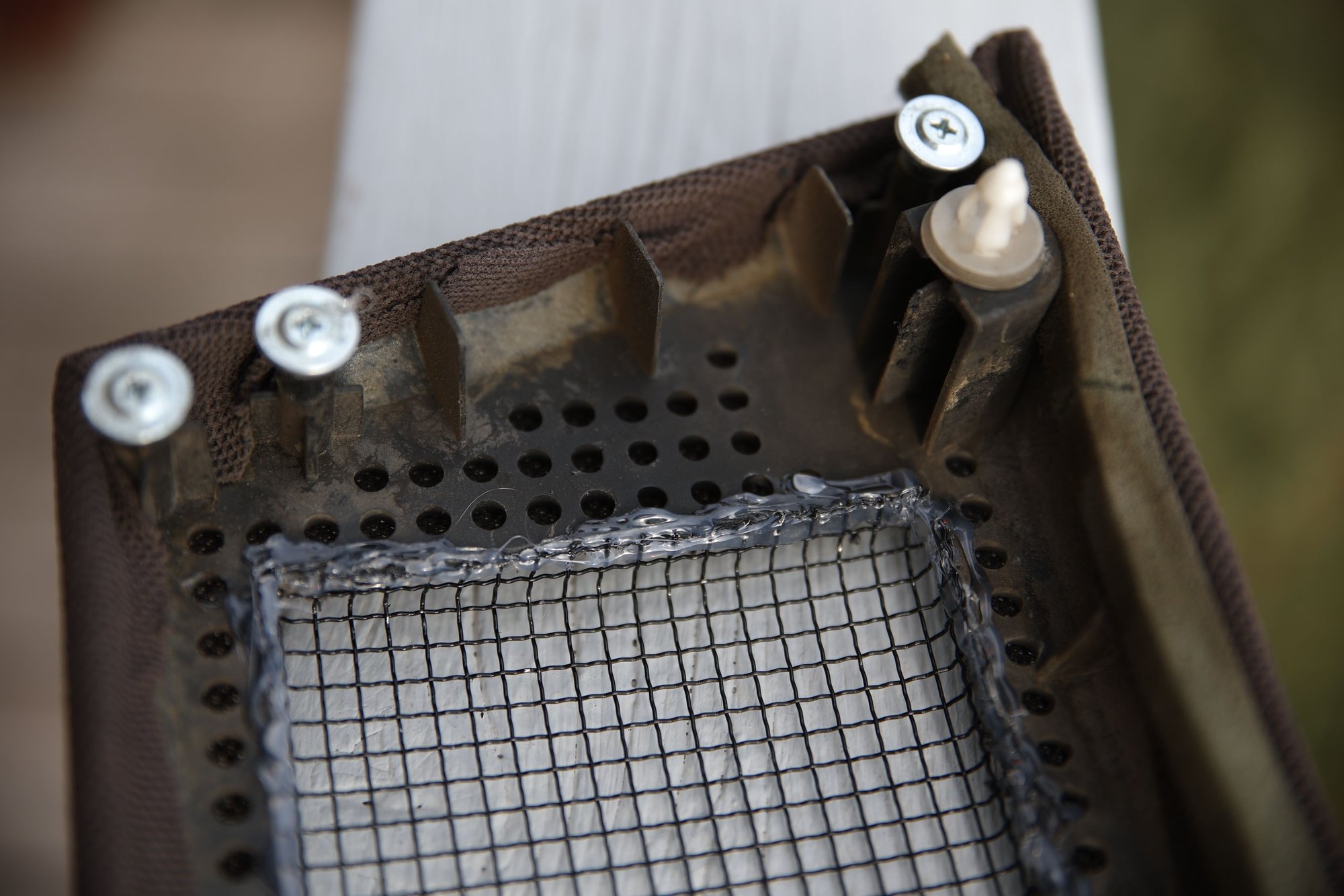 Hot glue holding in the wire.