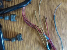 So this is my harness. I just opened it up. Ive seen a picture that says. Injector 4 is top right of the 8 pin plug for the resistor box. 12 volts below it and to the left injectors 123. Correct me if im wrong. Blue is injector 2 brown4 red3 yellow1. I cut the brown blue and two yellow and blacks ones. The solid red and yellow wires from 3 and 1 were taped down under electrical tape. The ''12v'' wire at the resister box plug goes and splits and takes the place of injector wires 1 and 3? Si