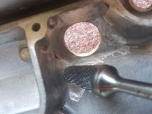Also from the area next to the OEM PCV valve. The grinder is directly above the nub which was removed and then filled via a screw from the outside.