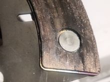 Friction material disintigrating around a rivet