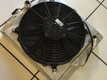 Fan shroud complete and switching to an hose so had bungs welded on the radiator. Now going to get the thermostat and water neck done then we can fire her up 