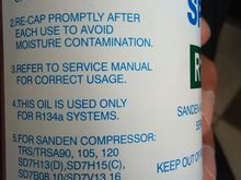 label on the back saying "add oil to discharge port"