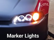 There are 3 small LEDs diagonally, the 2 Halo rings and an amber marker when the parking lights are on.