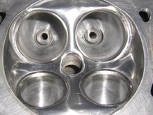 Ported/polish combustion chamber