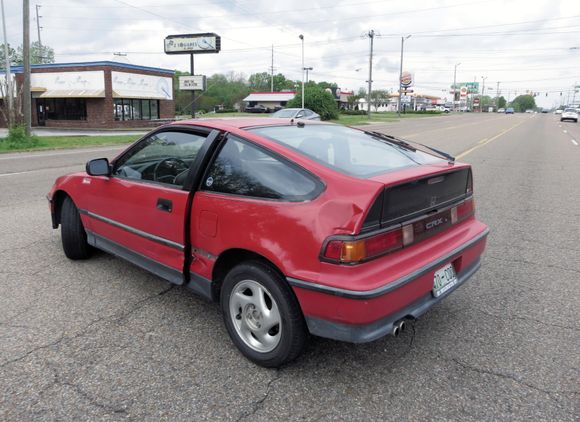 Left side rear. I think the crunch above the TL was the initial point of contact, after which I spun to the left.  I have no idea how many times I went around.  There was no chassis damage and I continued to drive the car.  Note I came to rest perpendicular to the lanes, half in the turn lane, half in the inside lane.  I was in the outside lane when the fun began.