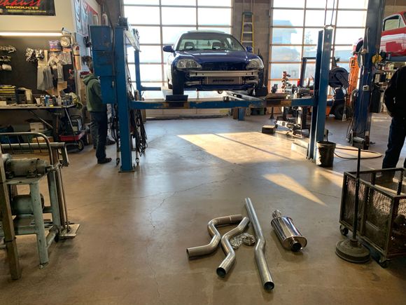 Soeedfactory 3” piping, mishimoto stainless steel band flange/clamp, and a vibrate muffler. 