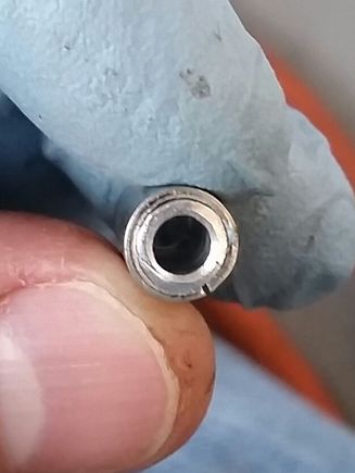 I found a tube that fit nicely into the spring mounting hole. I stepped down the inner diameter with an aluminum 1/8" tube so it would mate with the spring