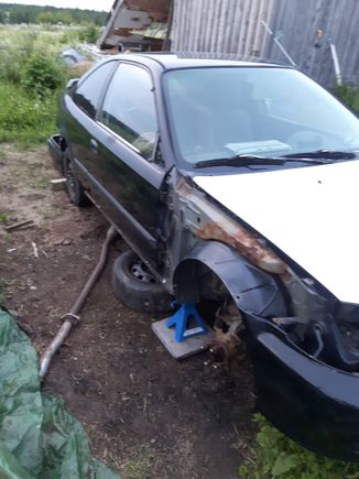 Picture of the parts car I took a while ago. Since this picture, I've put the rear end on jack stands and started dismantling the rear suspension