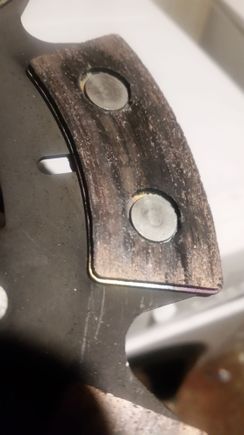 Friction material disintigrating around a rivet