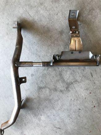 Cut the bracket and shoved the bushing in. 
Im going to weld the bidding the the left portion of the arm and the right part of it will be drilled to accept a 10mm bolt.