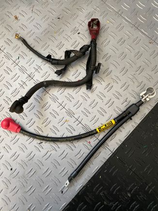 V1. Used 6g Motorsport battery cable for starter and artery o fuse box. Noticed bigger diameter would not allow for the small screw to fit without nodding.