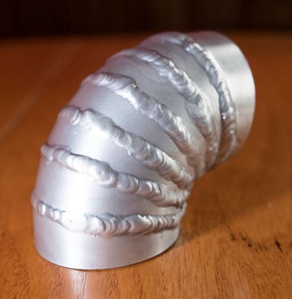 Yesterday's practice/attempt.  It will serve the purpose it needs to, but hopefully there's better to be done in the future.  This was with a 7.5* cut angle, and with just over a 1/8th inch inner width.  Tricky to weld those thin pieces!