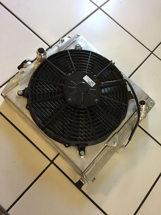 Fan shroud complete and switching to an hose so had bungs welded on the radiator. Now going to get the thermostat and water neck done then we can fire her up 