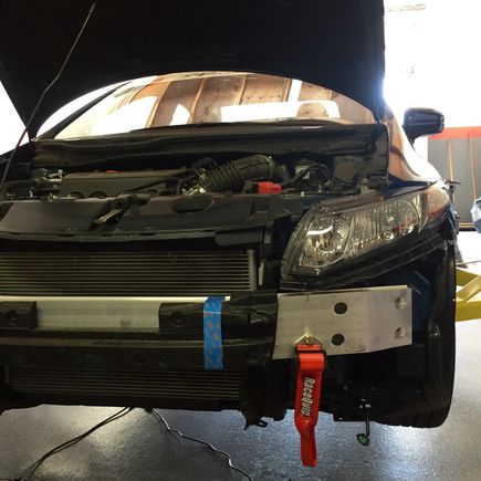 Crash beam foam trimmed to make room for tow point. Total point fastened with Grade a bolts and Nylock fastener.