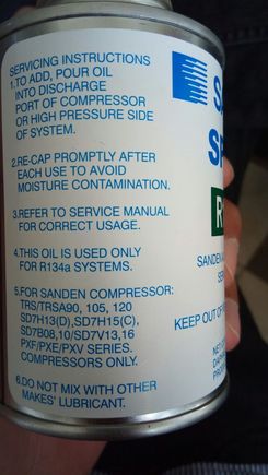 label on the back saying "add oil to discharge port"