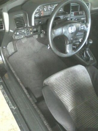 New mats and Lude steering wheel - before I got the correct round center cap.
