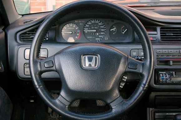 Modifications/Upgrades/Retrofits in this image:
OEM CDM/USDM Honda Access Optional Clock, 
OEM CDM Gauge Cluster w/ Tachometer, 
OEM Cruise Control,
OEM Tilt Steering, 
OEM CDM/USDM Si/EX Coupe Acoustic Research Door Panel Tweeters, 
OEM EDM Rear Fog Switch, 
OEM CDM '92 Si Black 4-prong non-SRS Steering Wheel w/Cruise (w/ optional leather upgrade),
OEM EDM Honda Access Optional Middle Console,
OEM JDM "Door Open" Indicator,
JDM 1-DIN Optional Cup Holder &amp; Tray.