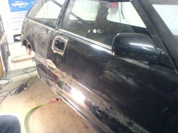 Getting rid of the rust that was bubbling under the paint. 
The doors were in pretty bad shape so I eventually ended up replacing them with better shape ones.