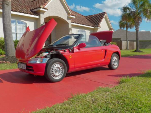 It has a hood like a Dodge Viper so you can pick up all the ladies.  Top up or down.