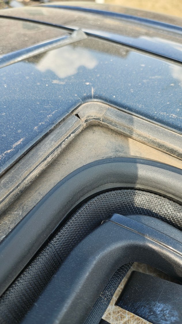 Sunroof drain. Very bottom of photo is the back side of the headliner.