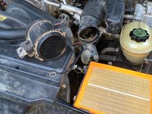 Air filter looks clean
Dried muddy water in air pipes - mass air flow pipe and part of air intake. I cleaned the air intake from the other side when I replaced the throttle body heater plate and took off the throttle body to clean it. I used throttle body cleaner or mineral spirits on the air intake - can’t remember now. 