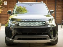 2017 Discovery HSE LUX, Supercharge, Farallon black, vintage tan interior, InControl Pro, 21" 9-spoke diamond turned wheels, Huber Optik tint (30% 1st row, 70% 2nd row and rear, 5% windshield), various added brushed silver trim plates (side mirrors, window controls, etc.), fixed side step, mud flaps, wheel locks, silver painted roof rails, gloss charcoal oak veneer.
