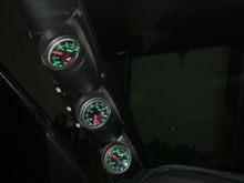 It is hard to get a good picture at night but these are my a-pillar gauges. The oil pressure sender is in the front cover where the oil cooler line would go. I know some people say it isn't as reliable but it has given me good reliable feedback and tells me more than the idiot light on the dash. I would say it saved my motor since it gave me the feedback to shut it down when my cam bearings slipped where the idiot light barely came on.