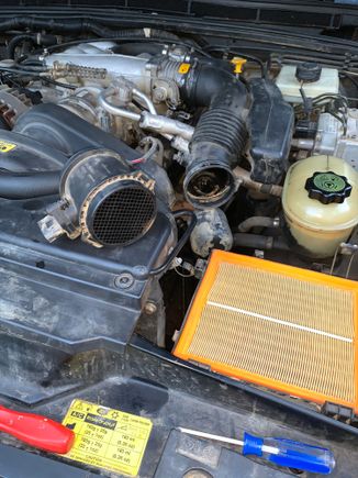 Air filter looks clean
Dried muddy water in air pipes - mass air flow pipe and part of air intake. I cleaned the air intake from the other side when I replaced the throttle body heater plate and took off the throttle body to clean it. I used throttle body cleaner or mineral spirits on the air intake - can’t remember now. 