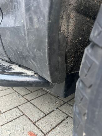 Trim and wheel well with zip tie. 